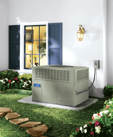 An outdoor AC unit sits on a concrete slab in a yard with green grass, flowers, and a stepping-stone pathway leading to a house with an open window.