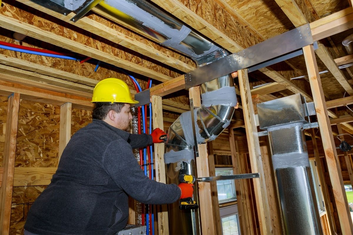 workers-making-final-air-duct-conditioning-hvac-sy