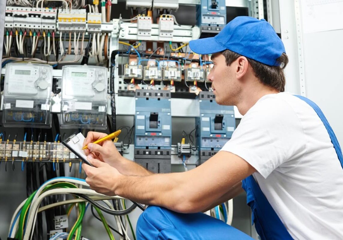 Electrician Worker Inspecting the Electrical panel