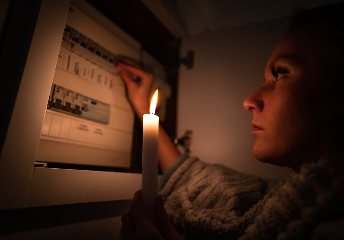 women-checking-circuit-in-dark Women Checking Circuit in Dark